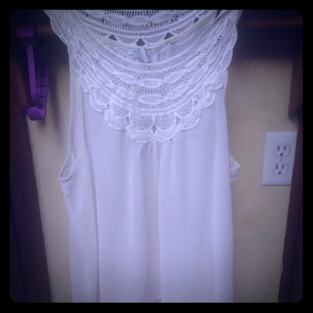 Sheer off-white sleeveless blouse